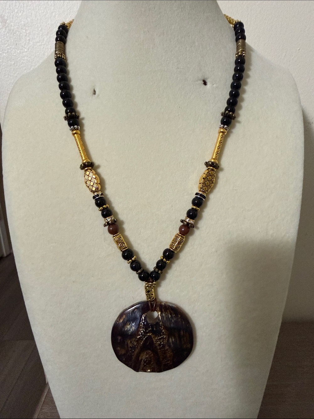 Artisan Black and Gold Beaded Necklace with Brown Pendant